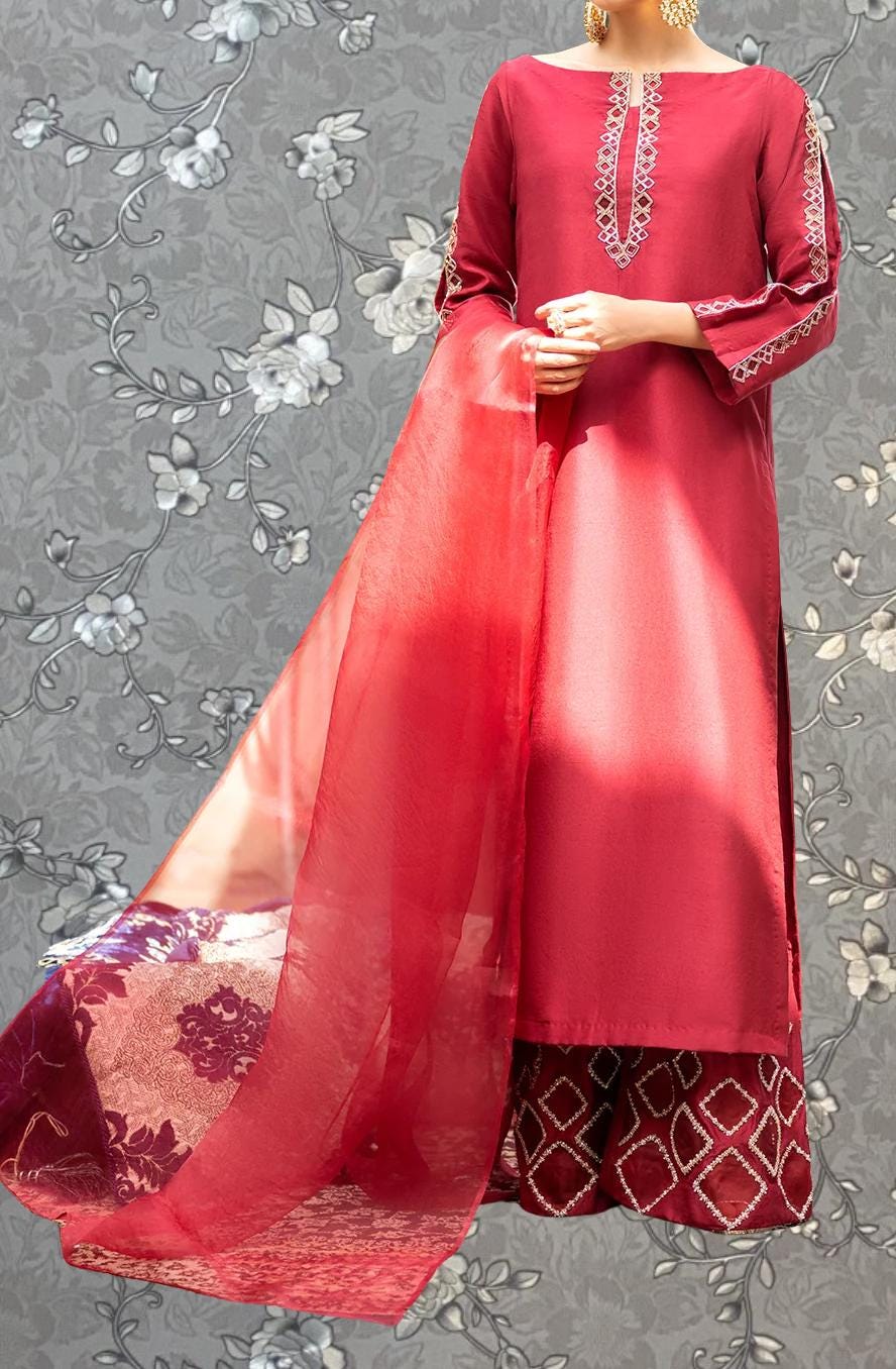 A mannequin wearing a red dress with a long, flowing skirt and a matching red shawl.