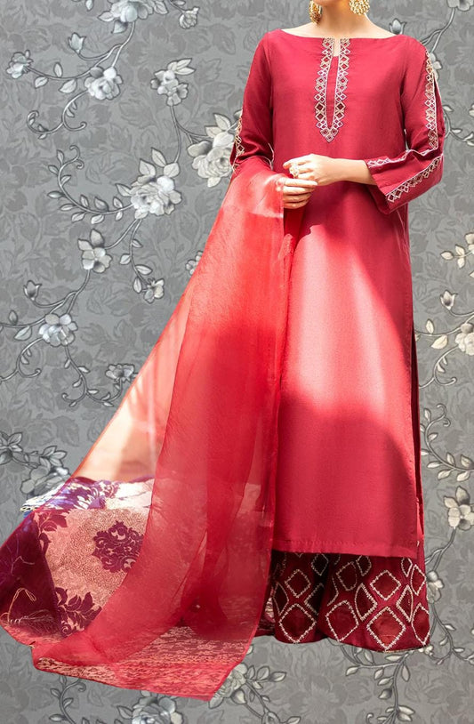 A mannequin wearing a red dress with a long, flowing skirt and a matching red shawl.