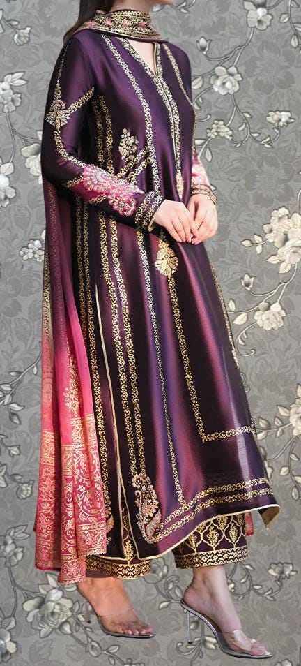 A woman wearing a long, purple dress with gold embroidery and a matching pink shawl.