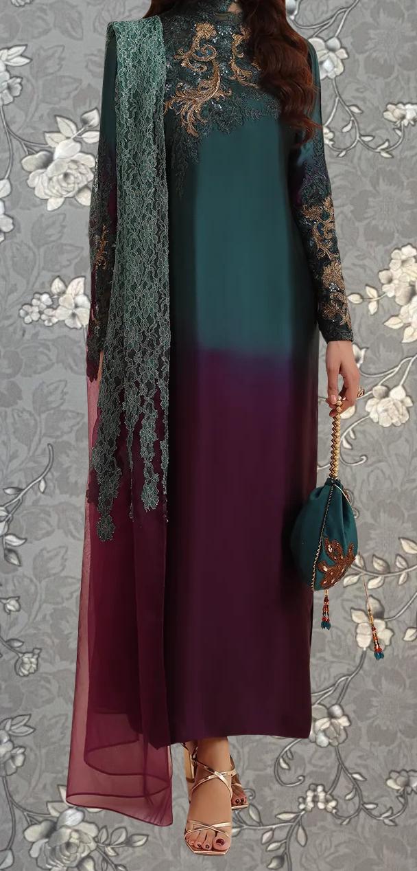 A woman wearing a long, green and purple dress with intricate embroidery, holding a small purse, and standing against a gray floral background.