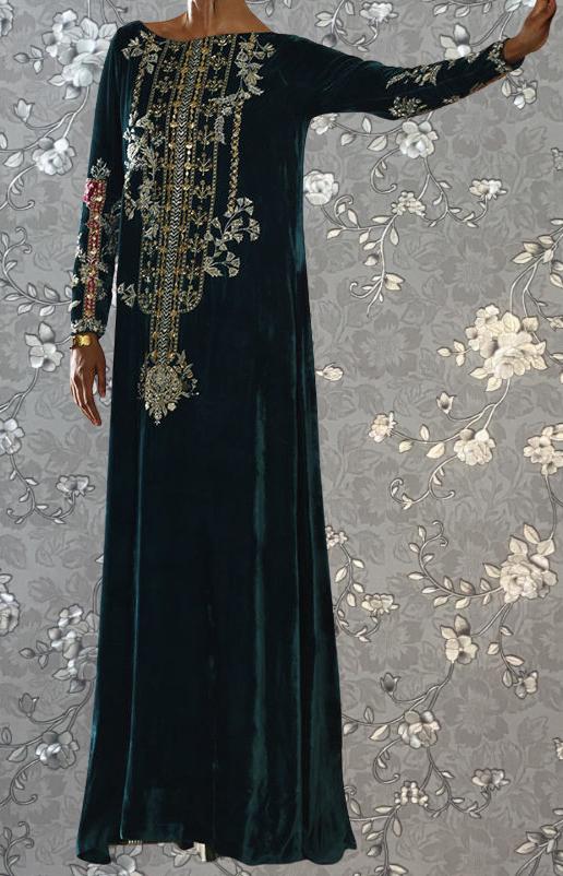A long, dark green velvet dress with intricate gold embroidery and floral patterns.