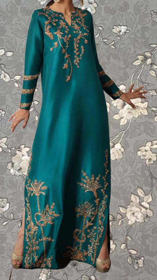 A woman wearing a long, teal-colored dress with gold embroidered patterns on the front.