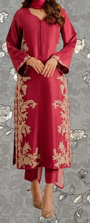 A woman wearing a red dress with gold embroidery stands against a gray floral background.